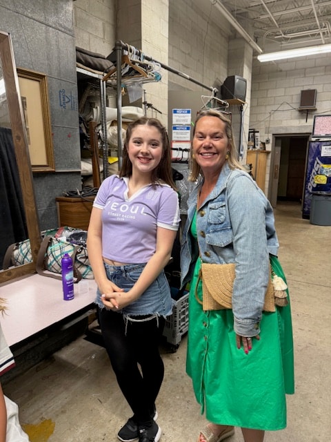 Fitzpatrick dancer with a parent backstage before the show