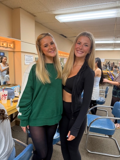 Two Fitzpatrick dancers backstage getting ready