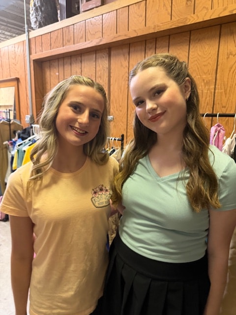 Two Fitzpatrick dancers smiling backstage before a show
