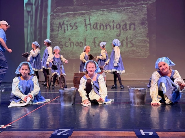 Full stage view of the Miss Hannigan dance show number