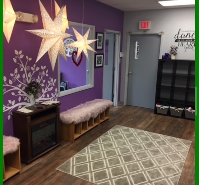 Fitzpatrick Studio lobby entry with purple walls, star lanterns, and inspirational dance quote